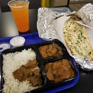 Lamb curry and garlic naan with raita.