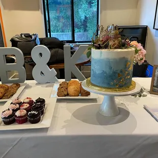 a cake and pastries on a table
