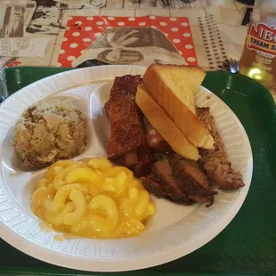 Ribs brisket Mac and cheese baked potato salad with Texas toast