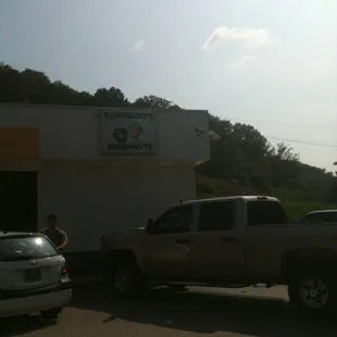 a truck parked in front of a building