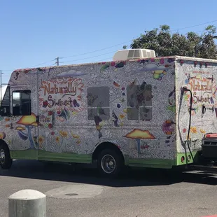 an ice cream truck parked in a parking lot