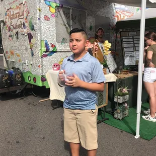 My baby boy enjoying his açaí bowl