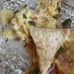 a piece of food wrapped in tin foil