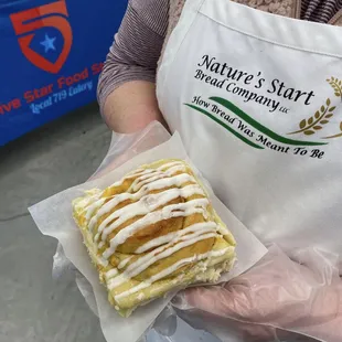 a person holding a pastry