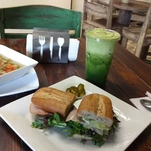 a plate of soup and a sandwich