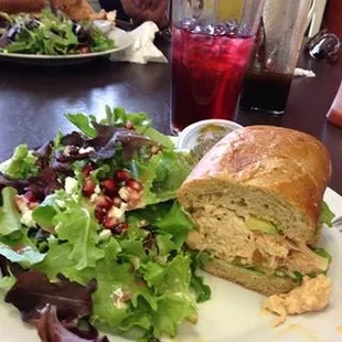 a sandwich and a salad on a plate