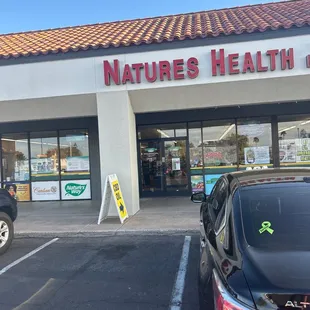 a car parked in front of the store
