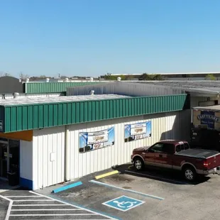 a truck parked in front of the building
