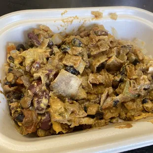 a dish of food in a styrofoam container