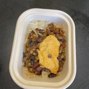 a bowl of beans and tortilla