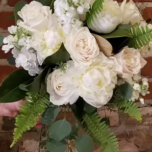 Wedding Bouquet of peonies, roses ,stock and greenery.