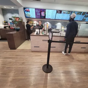 a man standing in a fast food restaurant