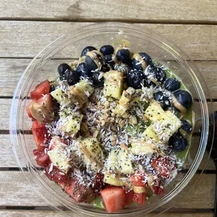 a bowl of fruit salad on a table