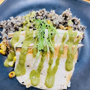 Seared trout with wild rice and roasted corn medley.
