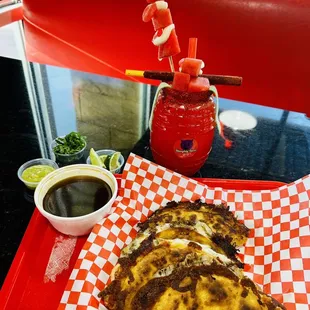 a red and white checkered tray of food