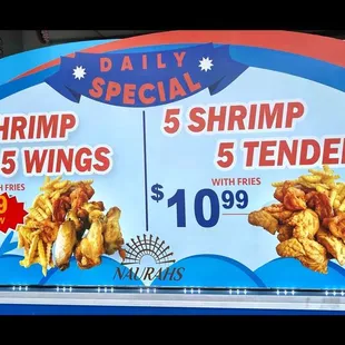 a sign advertising shrimp and wings