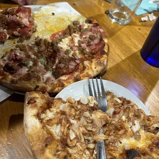 two pizzas on a table