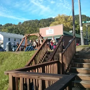 Photo of the bar taken from a balcony that overlooks the river.