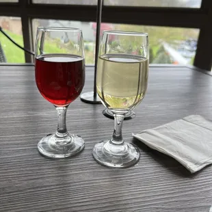 two glasses of wine on a table