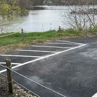 a parking lot next to a lake