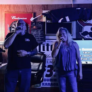 a man and a woman singing