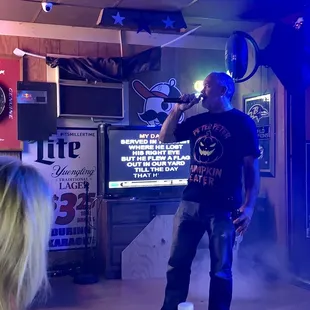 a man singing into a microphone