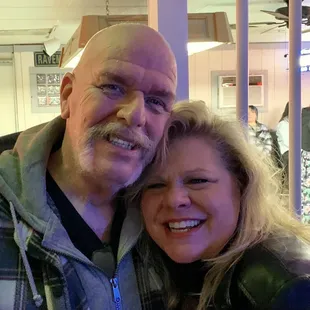 a man and woman posing for a picture
