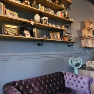 a purple couch in a coffee shop