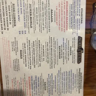 Menu is already under plexiglass on the table .
