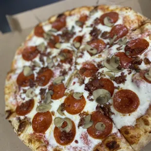 a pepperoni and olive pizza