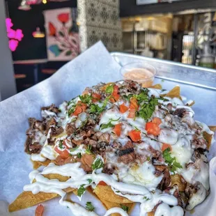 Super Nachos or Super fries both are a great option and a good portion