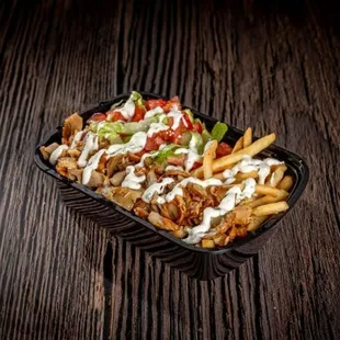 FRENCH FRIES BOWL-Beef n lamb or chicken, french fries, tomato, pickles, lettuce, tzatziki sauce.