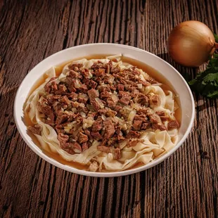 BESHBARMAK-Finely chopped boiled meat mixed with noodles and onion