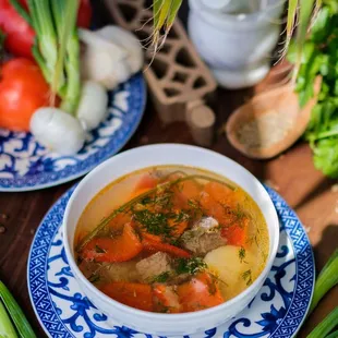 Beef Soup Shorpo-Rich aromatic meat broth with chunks of meat, potato, carrots and fresh herbs.