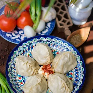 Manty/Dumplings-Finely chopped beef meat and onion seasoned with black pepper, and wrapped in handmade thin dough. steam cooked. served with