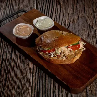 Navat Chciken pita- Chicken, tomato, cabbage, cucumber, Navat red sauce, Navat white sauce.