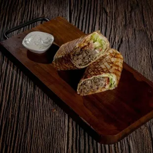 Greek Gyro Wrap - Beef, lamb, tomato, pickles, French fries, lettuce, tzatziki sauce