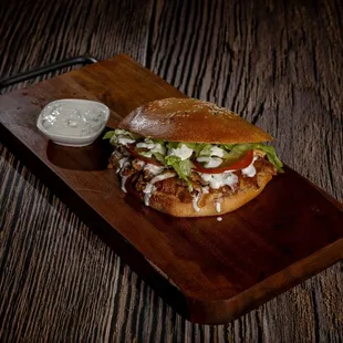 Greek Chicken Pita - Pita bread, Chicken, tomato, pickles, French fries, lettuce, tzatziki sauce