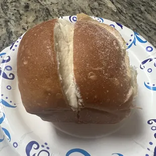 a sandwich on a paper plate