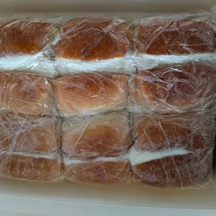 a box of rolls wrapped in plastic