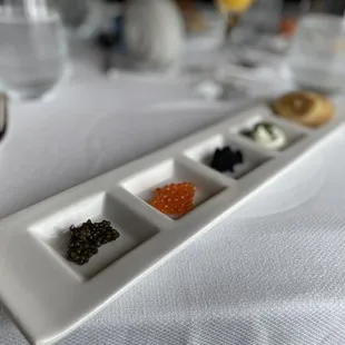 Caviar tasting - sturgeon, trout, and bowfin. Served with soft crepes and crème