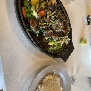 Bangkok hot plate with beef, carrots, onions, cauliflower, squash, and pepper