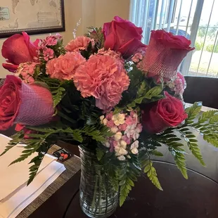 Full bloom roses delivered. Held together with a net.