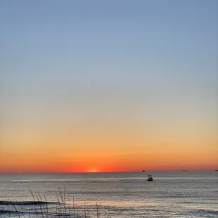 Sunrise by the beach across the Lodge