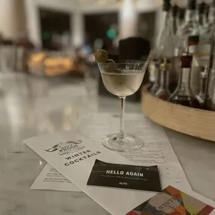 a martini and menu