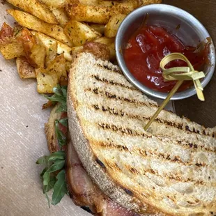 BLT sandwich with avocado sourdough bread, french fries with thick Canadian fresh bacon