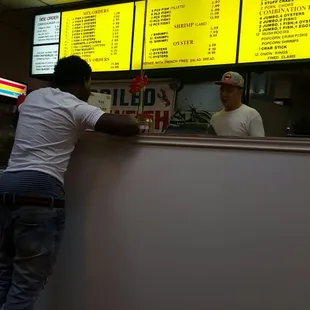 a man ordering food at a restaurant