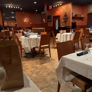 a dining room with tables and chairs