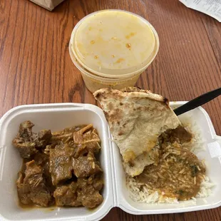 Goat curry, rice, and garlic naan bread. Absolutely delicious