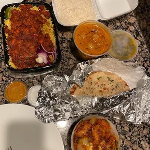 Boneless Chicken Biryani, Gobi Manchurian, Chicken Tikka Masala, and Garlic Naan